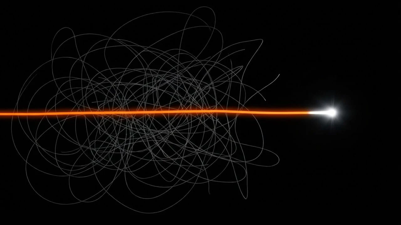 Winning ad creative: Chaos to Clarity, an orange line cutting through a gray tangle